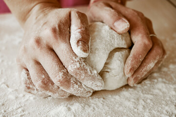 Fototapeta na wymiar hands kneading dough, baker, the Baker's hands, dough, hands in the flour, dumplings, handmade dumplings, ravioli