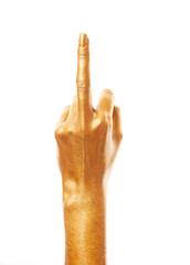 Hands in gold paint. Golden fingers. Female hand isolated on white background. White woman's hand showing symbols and gestures.