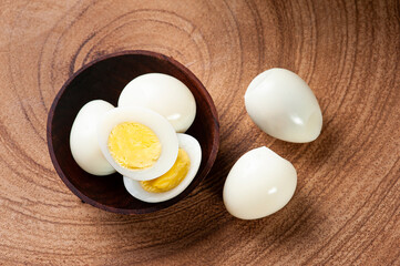 .Boiled quail eggs arranged on wooden background