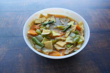  chicken vegetable soup on a black background