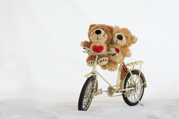 Love bear on a bicycle on white background