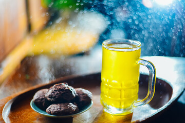 Chinese Chrysanthemum Tea in tall glass and  Brownie cookies  on festive new year background