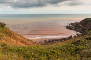 UK coastal landscape of a cove.
