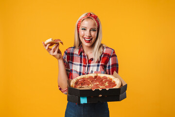 Image of happy charming pinup girl laughing while eating pizza