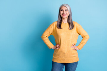 Photo of charming girlish pensioner lady white grey hairstyle hands hips look empty space planning...