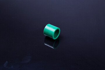  Plastic T-tube fittings on Black background, PVC Pipe connections, PVC Pipe fitting, PVC Coupling
