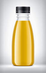 Plastic Bottle on background with Orange Juice. 