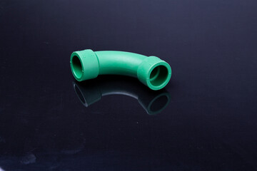  Plastic T-tube fittings on Black background, PVC Pipe connections, PVC Pipe fitting, PVC Coupling
