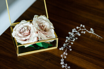 wedding rings close up and flowers