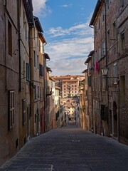 Lonely street at the old town of Siena at the Tuscany Region in Italy 