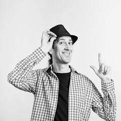 Happy man wears retro hat. Nerd smiling and looking to camera. Male fashion, lifestyle.