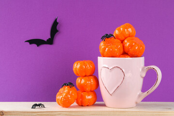 Halloween holiday concept with pumpkin decor on wooden table.
