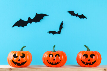 Fototapeta premium Halloween holiday concept with pumpkin decor on wooden table.