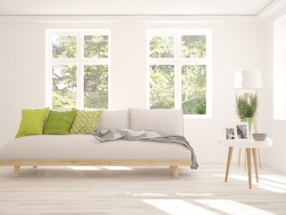 White living room with sofa and summer landscape in window. Scandinavian interior design. 3D illustration