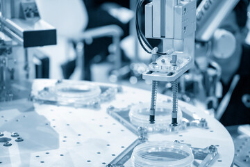 The pneumatic robotic arm picking the product parts in production line. The hi-technology  material...