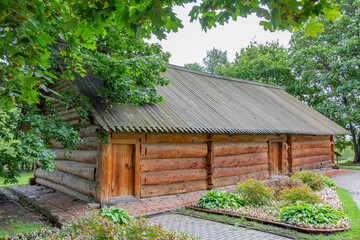 Exterior of an old wooden log house in the forest