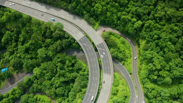 flyby over a Highway passing through the forest in the western ghats of India