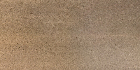 view from above on texture of old asphalt road with cracks