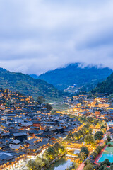 Fototapeta premium High-view night scenery of Qianhu Miao Village in Xijiang, Guizhou, China