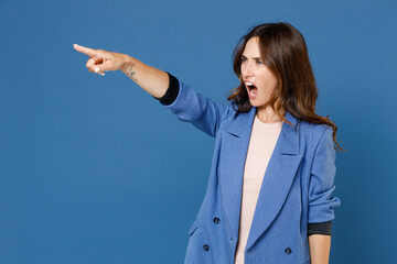Angry irritated displeased dissatisfied young brunette woman 20s wearing basic jacket standing...
