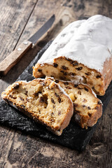 Christmas stollen fruit cake on wooden table