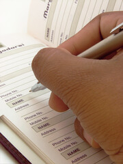 Obraz premium Data entry in telephone book
