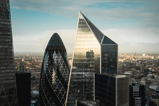 London, UK - October 18, 2019: View of the 30 St. Mary Axe and the Scalpel buildings from Sky Garden during sunset.