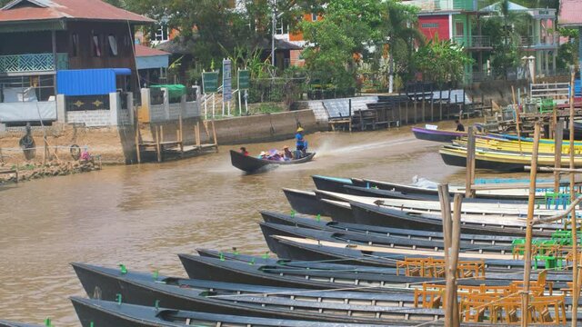 boats docking and a texi boat is passing by.
