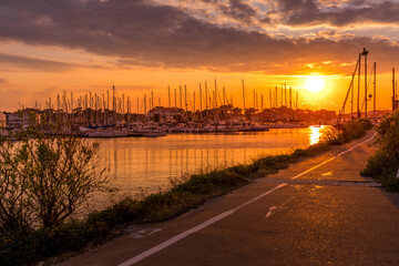 Port view in Capbreton during evening. Beautiful orange sunset. Wallpapers concept. High quality...