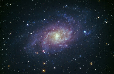 Fototapeta na wymiar M33 the Triangulum galaxy glowing in the night sky over Cornwall, UK