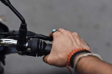 closeup of a india boy hand while riding a bike 