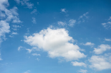 Naklejka na ściany i meble White fluffy clouds with blue sky