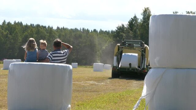 Multi Generation Farmers And Hay Bale Rolls, Harvesting Summer Season Scene