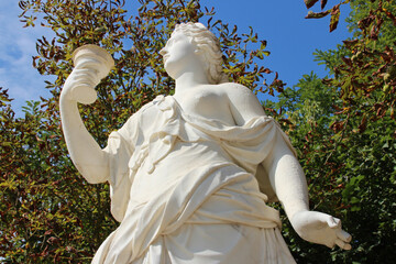 mythological statue (artemesia) in a park in versailles (france)