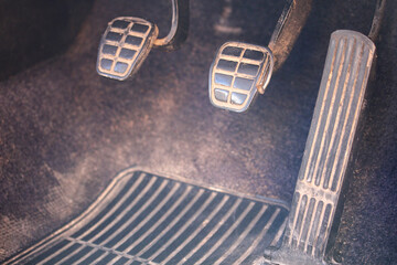 Dirty pedals of a classic car