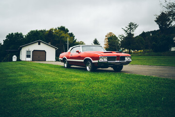 Retro old red vintage American car near shabby barn © BullRun