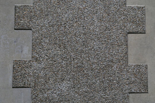 A closeup view of a pebbledash or rough cast wall.