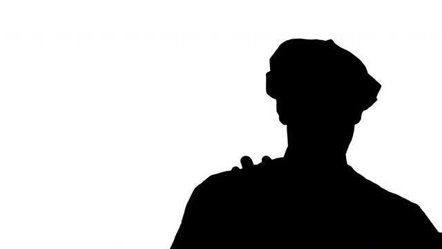 Silhouette Young funny mime behind an invisible wall.