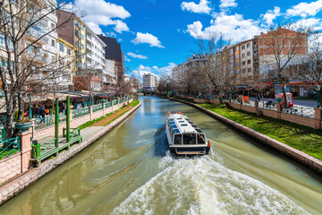 Obraz premium People are taking tour on Porsuk River in Eskisehir. Eskisehir is a modern city in center of Anatolia.