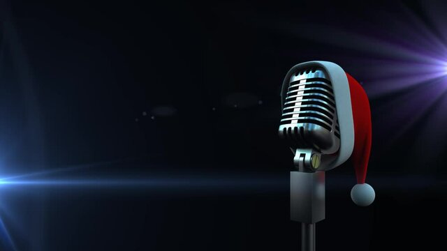 Microphone with Santa hat against spots of light on black background