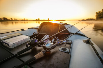 Naklejka premium Fishing object background. Bait casting fishing reel end rod.