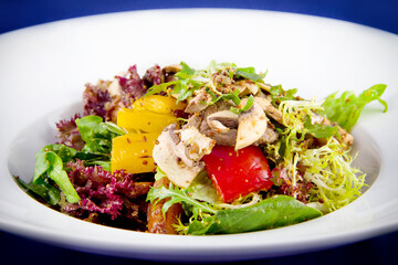 Vegetable salad with mushrooms, bell peppers, onions, lettuce and sauce with mustard seeds.