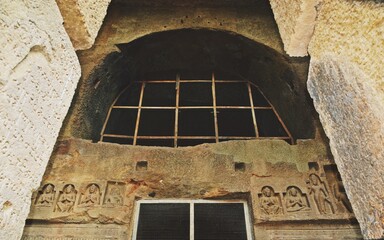 ancient window in buddhist cave temple 