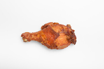 Close up fried chicken drumstick with chilli on isolated white background. Asian hot and spicy chicken leg with clipping path.  Thai local food.