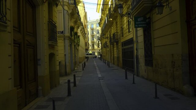 Walking through the street of Valencia on a sunny day in spring.