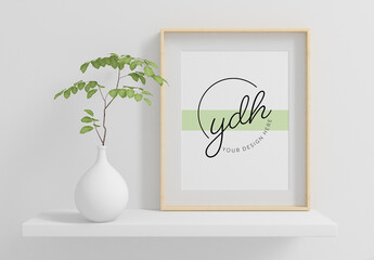 Vertical Frame on a Shelf with Plant Mockup 