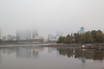 Fototapeta premium city embankment in the fog