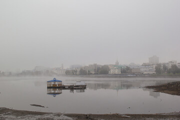 city embankment in the fog