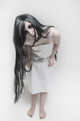 Mystical witch woman looking at you on gray