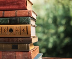 Collection of old books stack on blur background